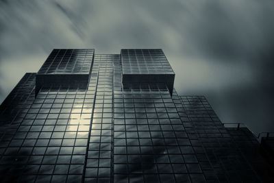 Low angle view of building against cloudy sky