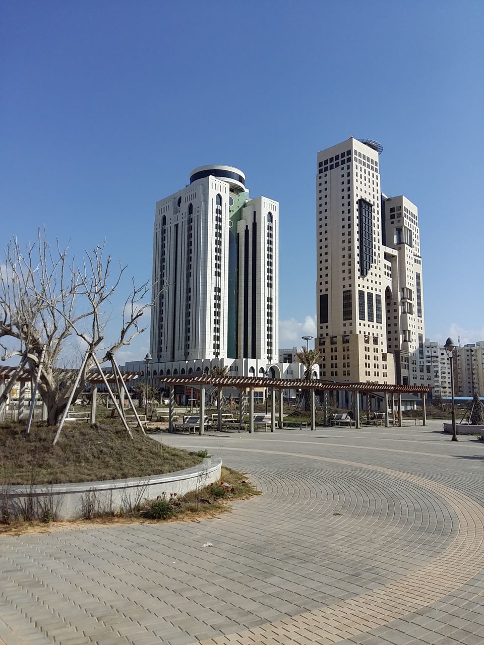 architecture, skyscraper, city, modern, built structure, building exterior, outdoors, clear sky, no people, day, travel destinations, blue, sky, tall, cityscape