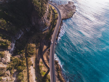 Aerial view of bridge by sea