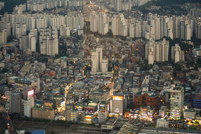 High angle view of illuminated buildings in city