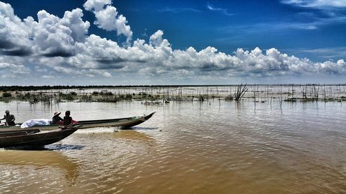 Scenic view of sea against cloudy sky