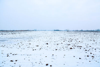 Scenic view of frozen lake against clear sky