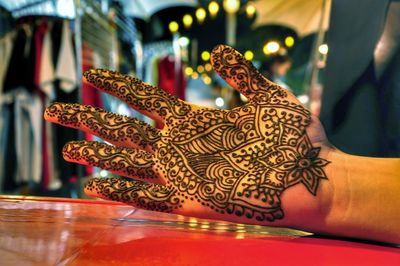 Close-up of human hand with henna tattoo