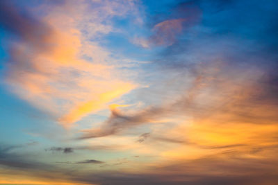 Low angle view of dramatic sky during sunset