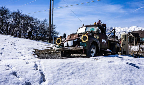 Cars on snow covered landscape