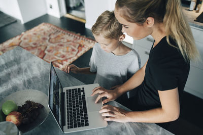 Woman using laptop on table