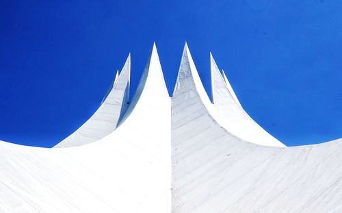 Low angle view of building against blue sky