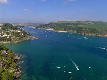 High angle view of sea and bay against sky