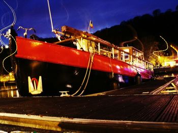 Close-up of illuminated boat moored at night