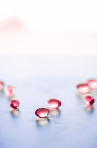 Close-up of pills on white background