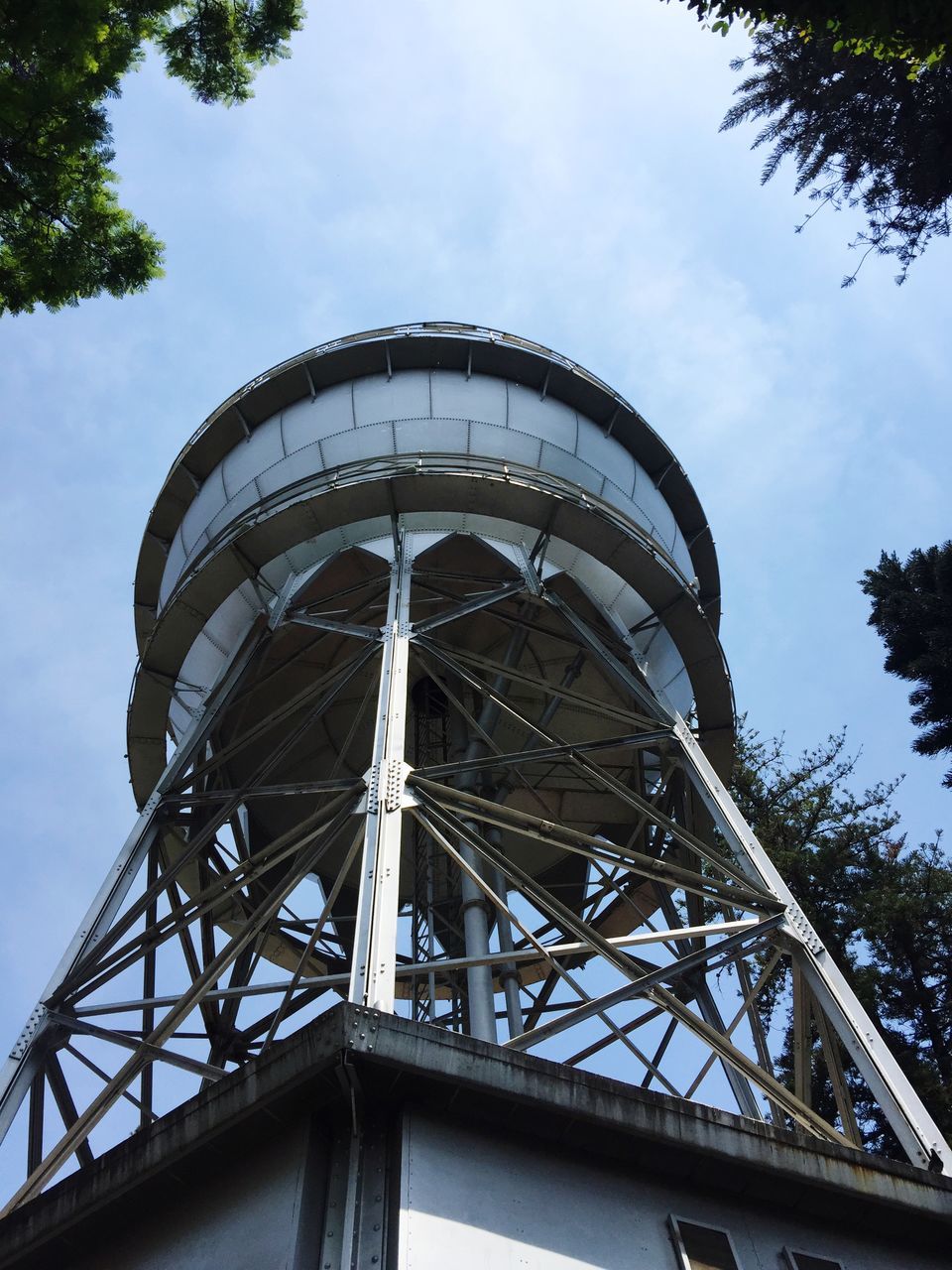 built structure, architecture, sky, low angle view, nature, day, cloud - sky, tree, metal, no people, outdoors, water tower - storage tank, plant, arts culture and entertainment, building exterior, tower, connection, amusement park, storage tank, water conservation