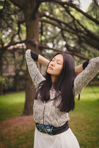 Portrait of young woman in park