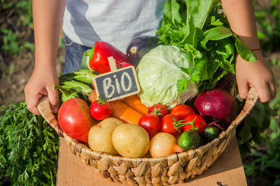 Midsection of man with vegetables