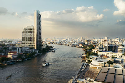 High angle view of city at sunset