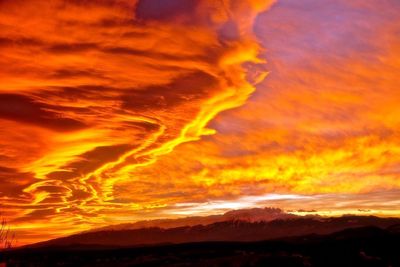 Scenic view of dramatic sky during sunset