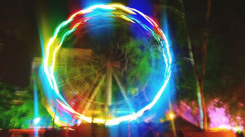 Low angle view of colorful light trails