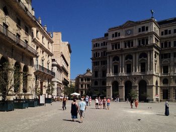 People in front of historical building