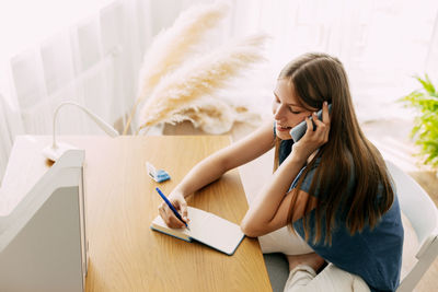 Young woman using mobile phone