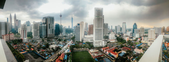 Modern buildings in city against sky