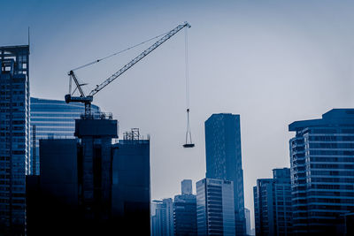 Low angle view of modern buildings against clear sky