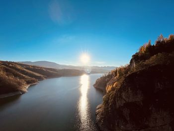 Scenic view of sea against clear blue sky
