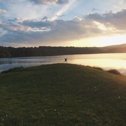 Scenic view of lake against sky during sunset