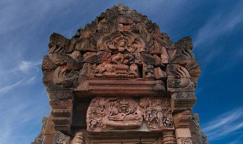 Low angle view of statue of temple against sky