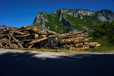 Stack of logs on mountain road