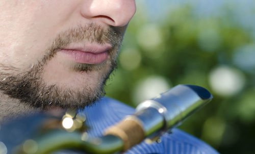 Close-up of man with saxophone