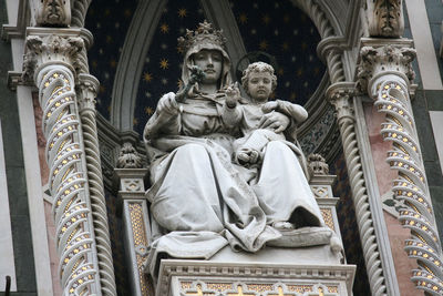 Low angle view of statue against building