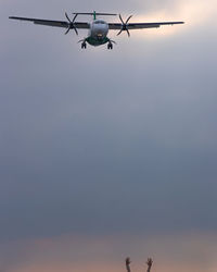 Low angle view of airplane flying in sky