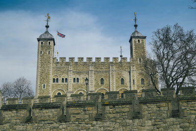 Low angle view of old building against sky