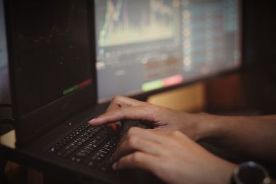 Midsection of person using mobile phone