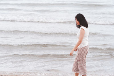 Woman standing at beach