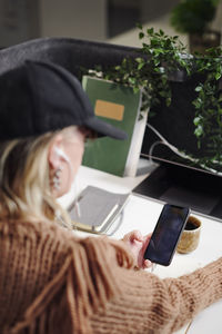 Woman's hands holding cell phone