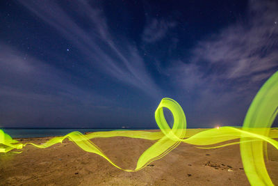 Scenic view of landscape against sky at night