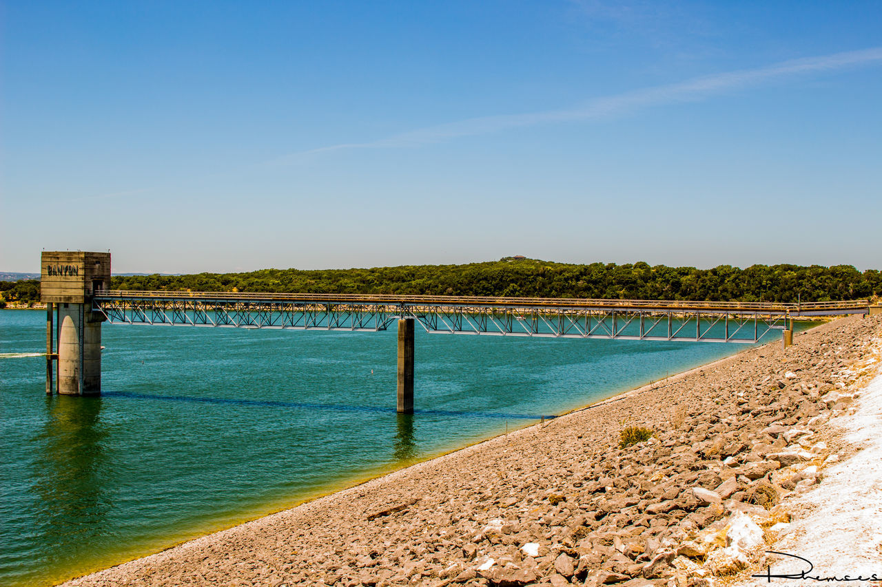 VIEW OF CALM SEA AGAINST BLUE SKY