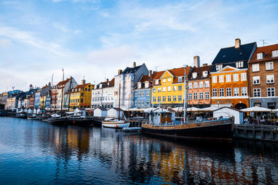 Nihavn docked boats along the pier in copenhagen, denmark. 