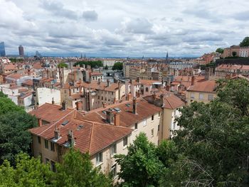 Buildings in city against sky