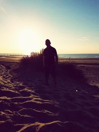 Rear view of man on beach