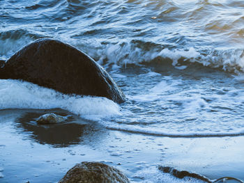 High angle view of rocks in sea