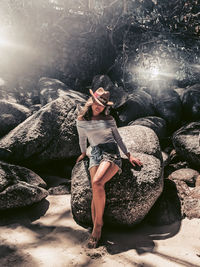 Full length of woman on rock