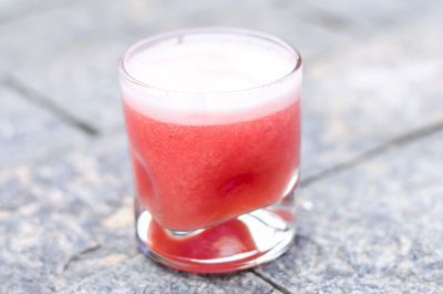 Close-up of strawberry juice on table