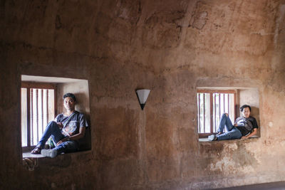 Man sitting on wall