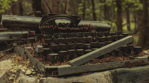 Close-up of abandoned truck on field