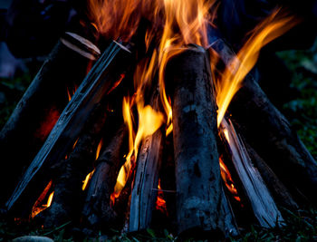 Close-up of illuminated bonfire at dusk