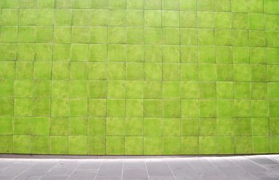 Close-up of green tiled wall