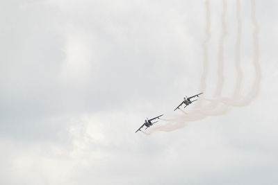 Low angle view of airplane flying in sky