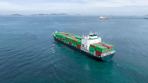 Aerial view container ship full load logistic container, global business logistics import export.