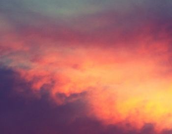 Low angle view of cloudy sky at sunset